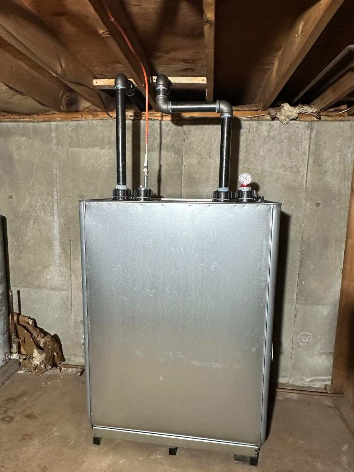 Newly installed oil tank with clean copper supply lines in a Long Island basement